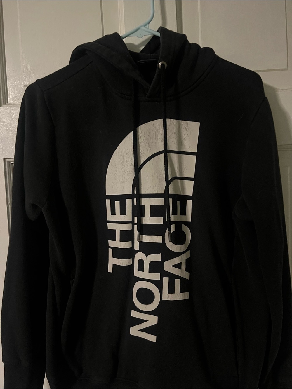 The North Face Black Hoodie with Large White Vertical Logo